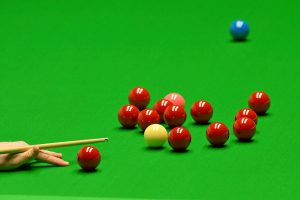 Generic snooker balls shot with a bridge hand playing a shot.