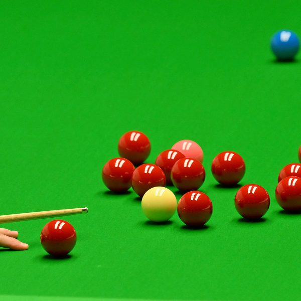 Generic snooker balls shot with a bridge hand playing a shot.