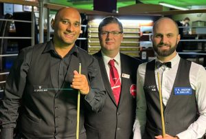 Johal and Hallworth pose for a photo before the final with referee Robin Dalgliesh standing in between them.