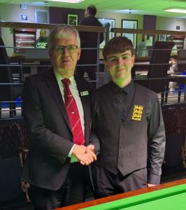 Tournament director Graham Mason shakes hands with Oliver Sykes.