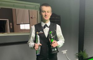 Ryan Davies holds the English Under-21 Snooker Championship trophy.