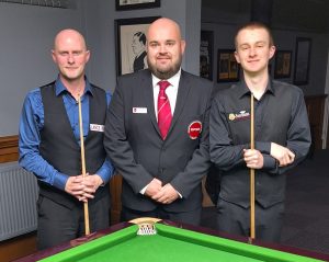 Craig Steadman and Ryan Davies pose for a photo either side of referee Josh Tunnicliffe.