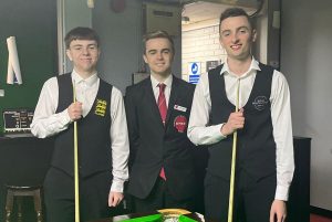 Oliver Sykes and Aidan Murphy stand either side of referee Steven Hughes before the final.